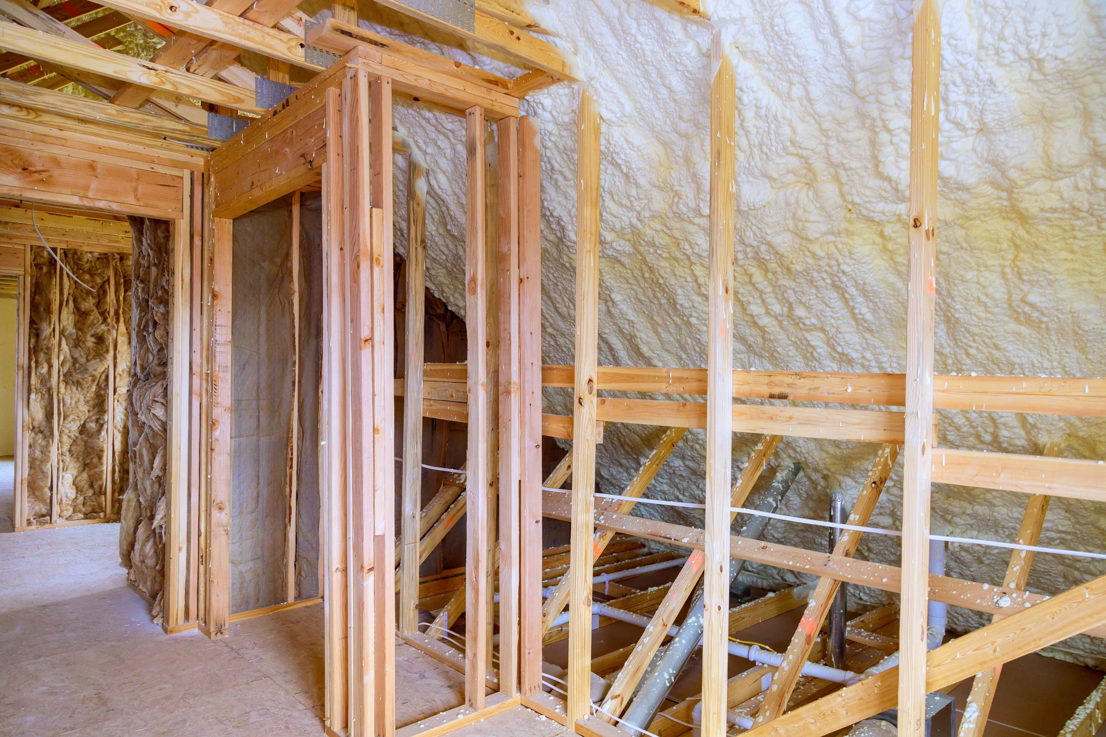 Spray foam insulation applied to attic roof framing