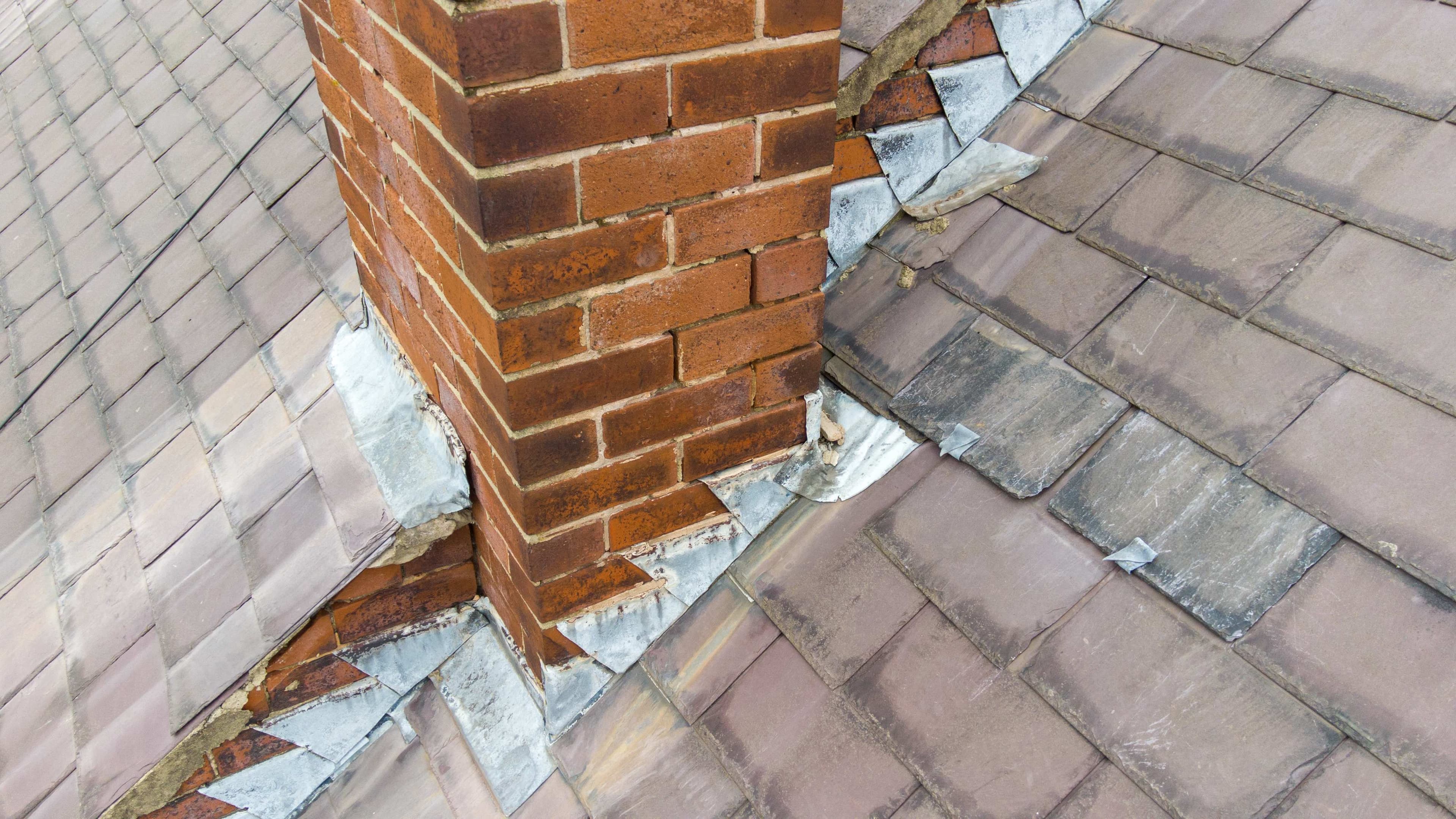 Brick chimney exterior flashing on a tile roof