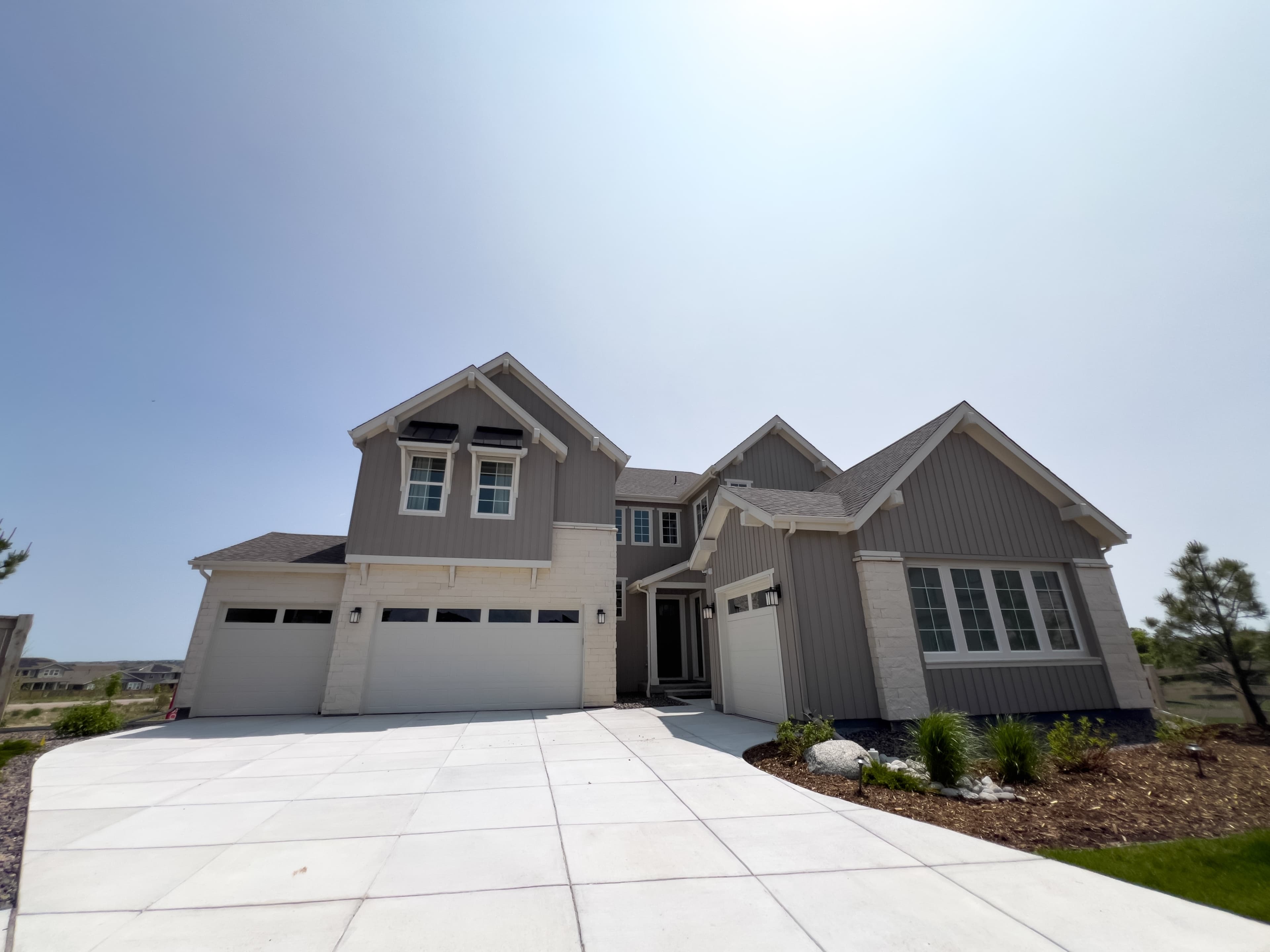 Residential concrete driveway leading to a home garage