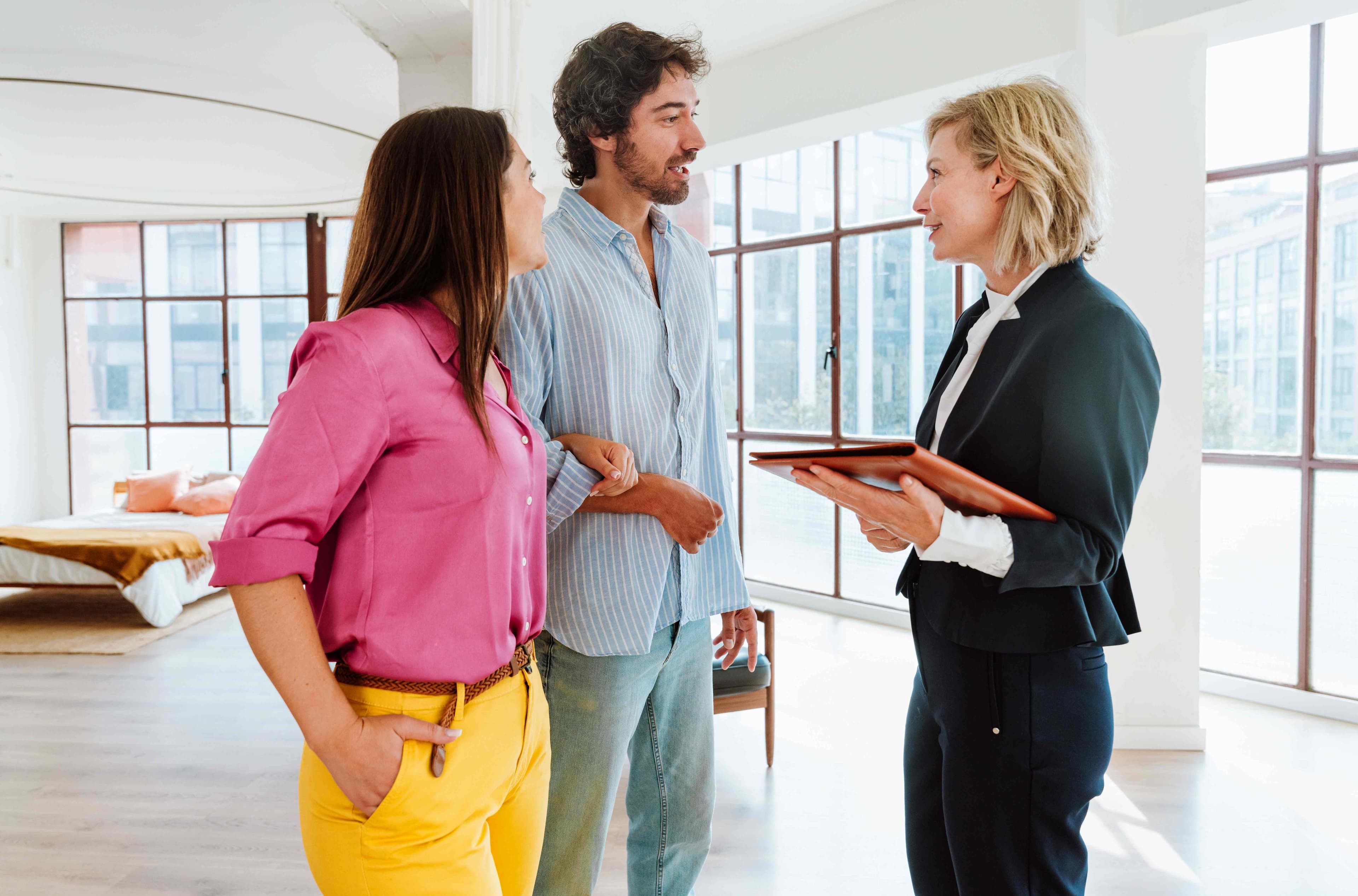 Property manager discussing a rental home walkthrough with tenants
