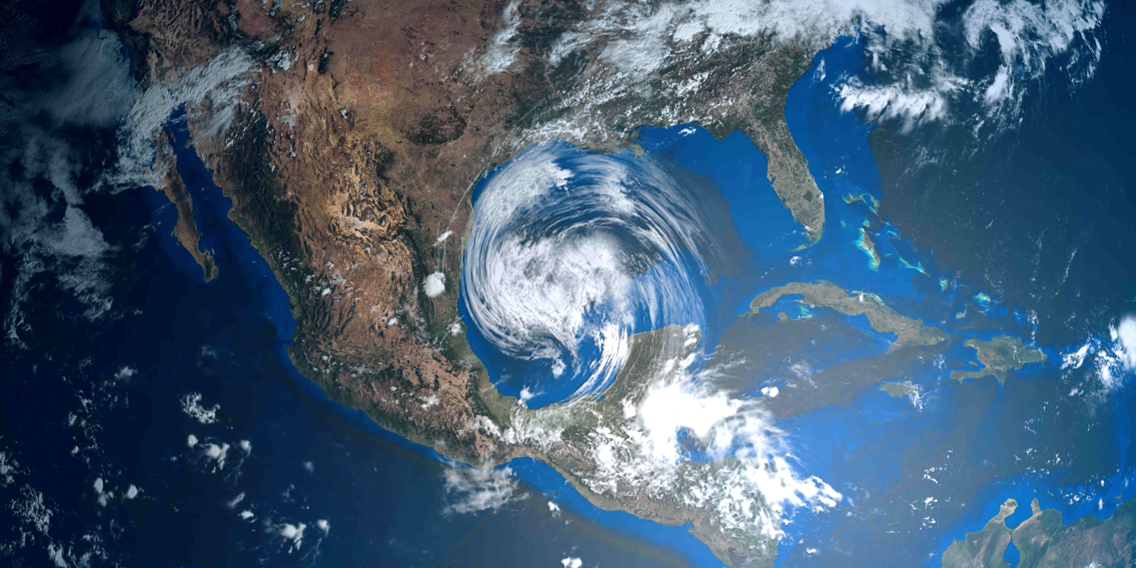 Satellite view of a large storm system swirling over the Gulf and southern United States